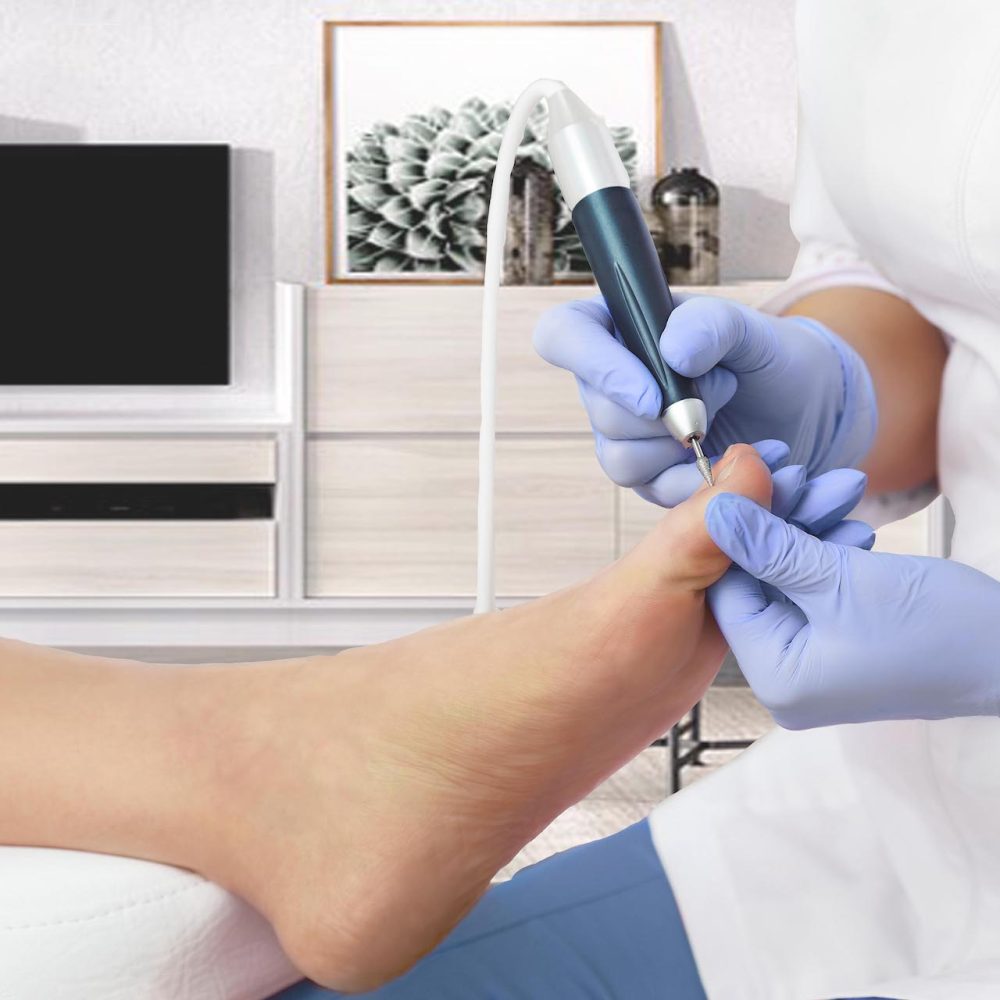 Professional hardware pedicure using electric machine.Patient on medical pedicure procedure, visiting podiatrist.Peeling feet with special electric device.Foot treatment in SPA salon.Podiatry clinic.